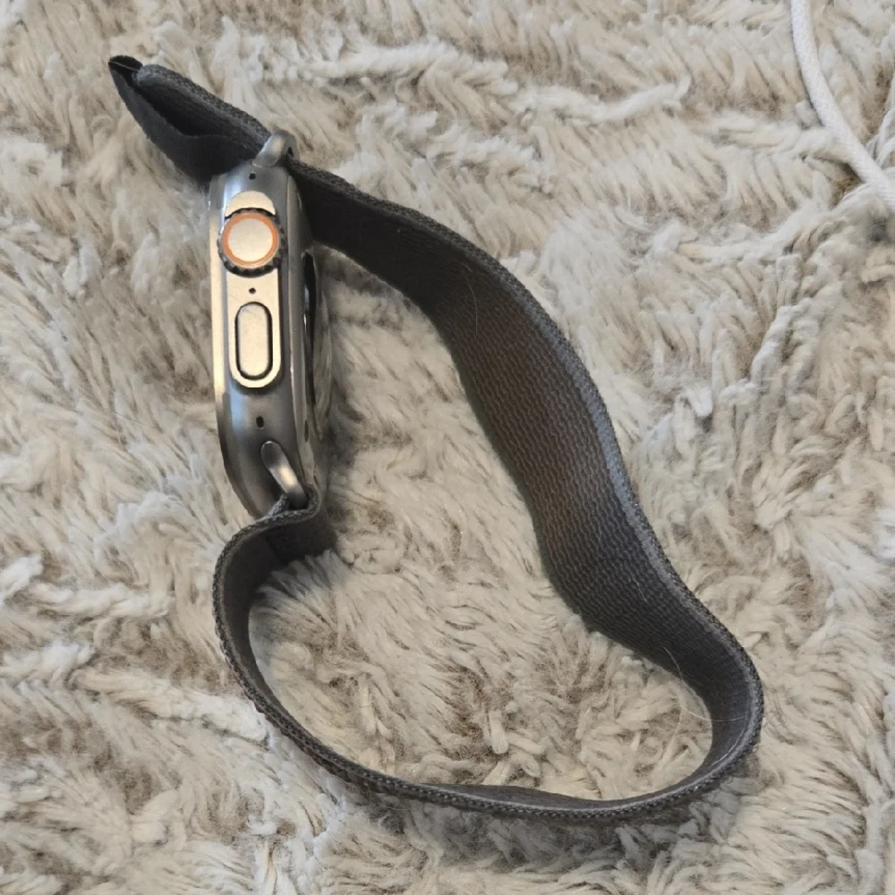 Advanced Smartwatch with Black Strap and Charger